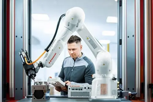 Engineer analyzing data and performing electrical and mechanical engineering tasks on computer